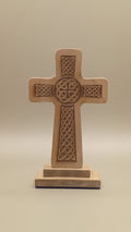 Beech wood Celtic cross with engraved Celtic knotwork on a freestanding wooden base