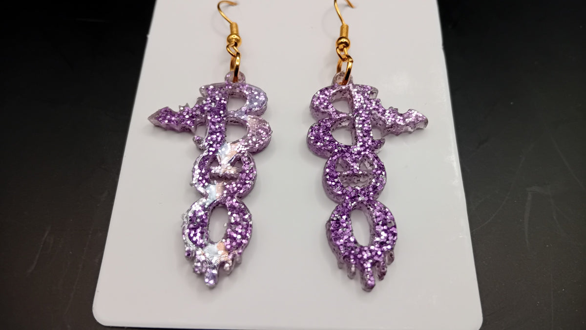 Purple sparkle BOO Halloween earrings with bat and pumpkin details