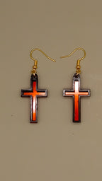 Red mirrored acrylic cross earrings with black layered frame and gold hooks