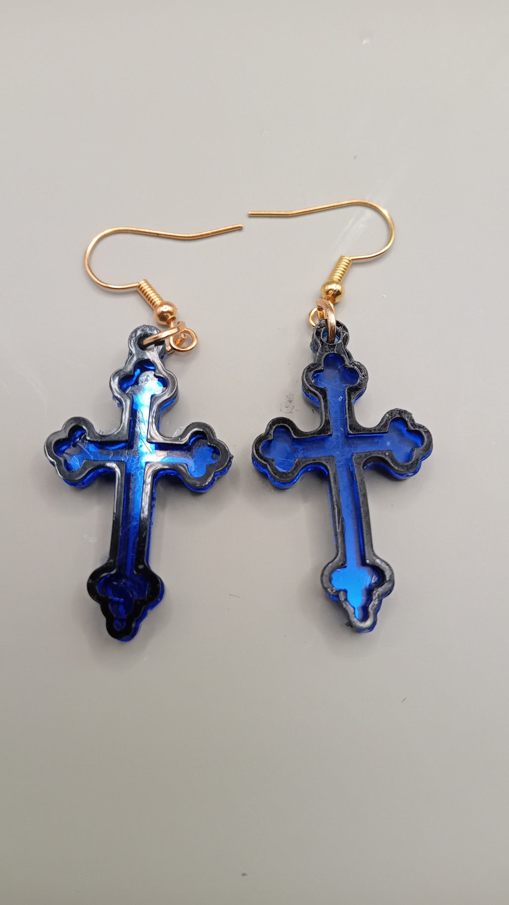 Blue mirrored Gothic cross earrings with black layered frame and gold hooks