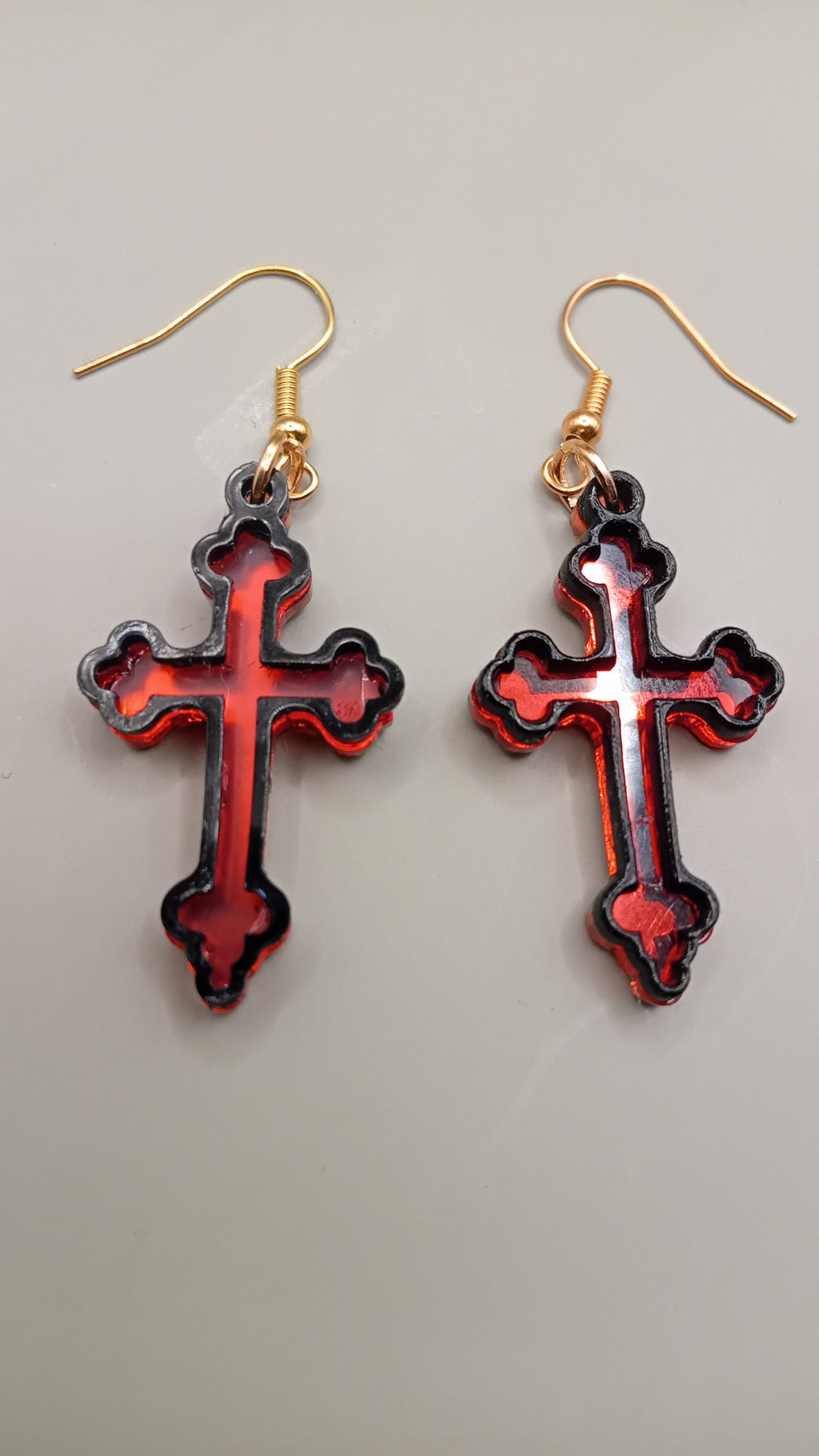 Red mirrored Gothic cross earrings with black layered frame and gold hooks