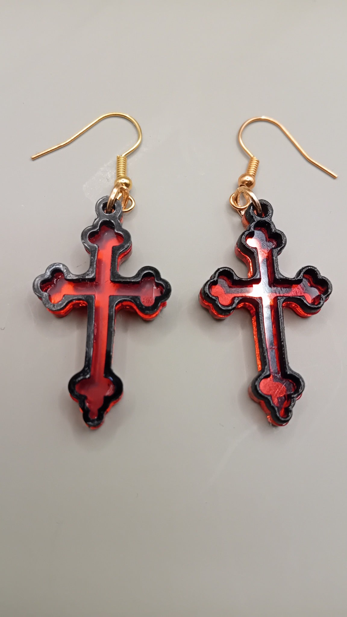 Red mirrored Gothic cross earrings with black layered frame and gold hooks