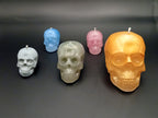 Handmade skull candles in white blue silver pink and gold colour variations