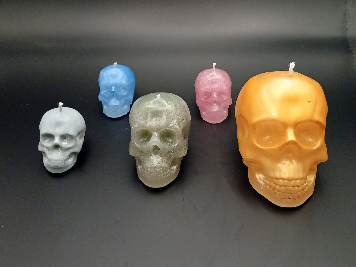 Handmade skull candles in white blue silver pink and gold colour variations